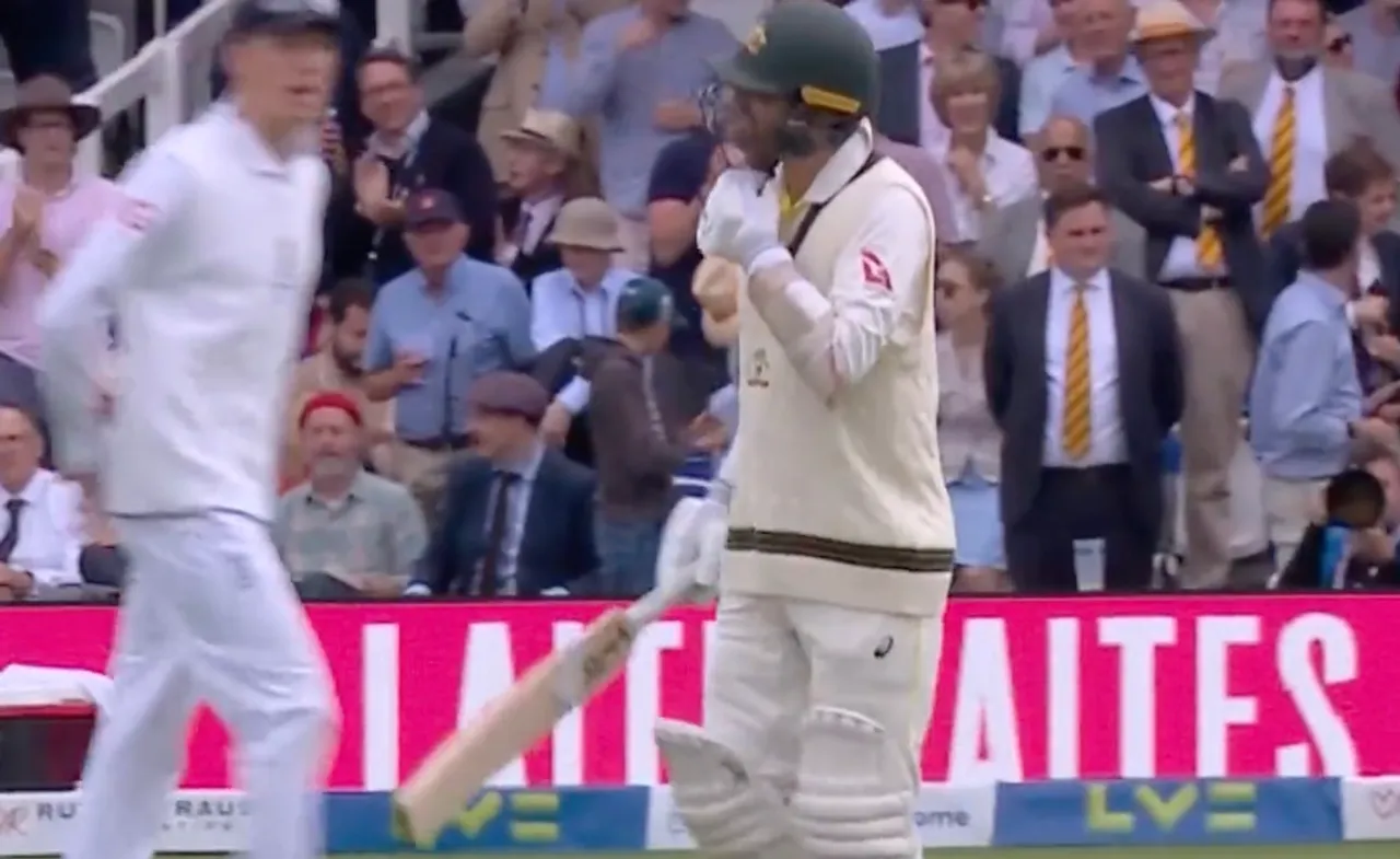 Nathan Lyon walks in to field with injured leg