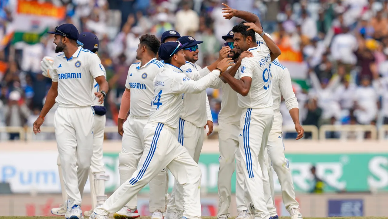 India's Ravichandran Ashwin with teammates celebrates the wicket of England's Joe Root