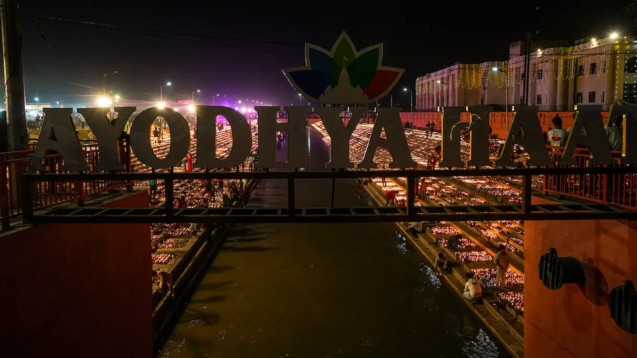 People light earthen lamps at Ayodhya Haat during Deepotsav (Diwali celebrations) in Ayodhya, Saturday, Nov. 11, 2023.