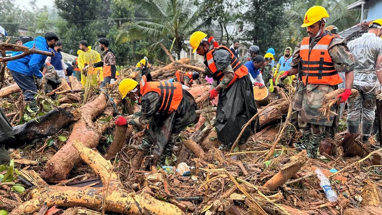 Armed Forces, NDRF, SDRF and civil administration personnel carry out rescue operation after landslides triggered by rain, in Wayanad district