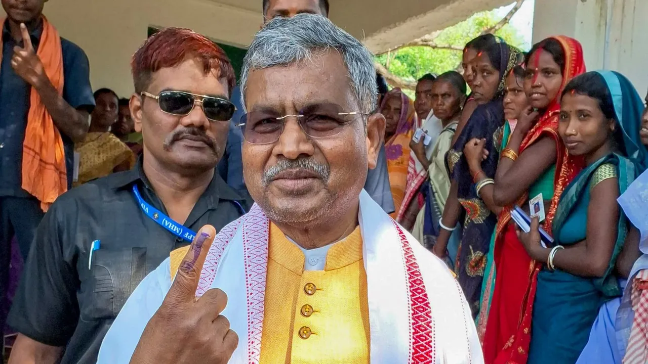 Jharkhand BJP President Babulal Marandi shows his inked finger after casting his vote during the Gandey assembly seat by-polls, in Giridih district, Monday, May 20, 2024