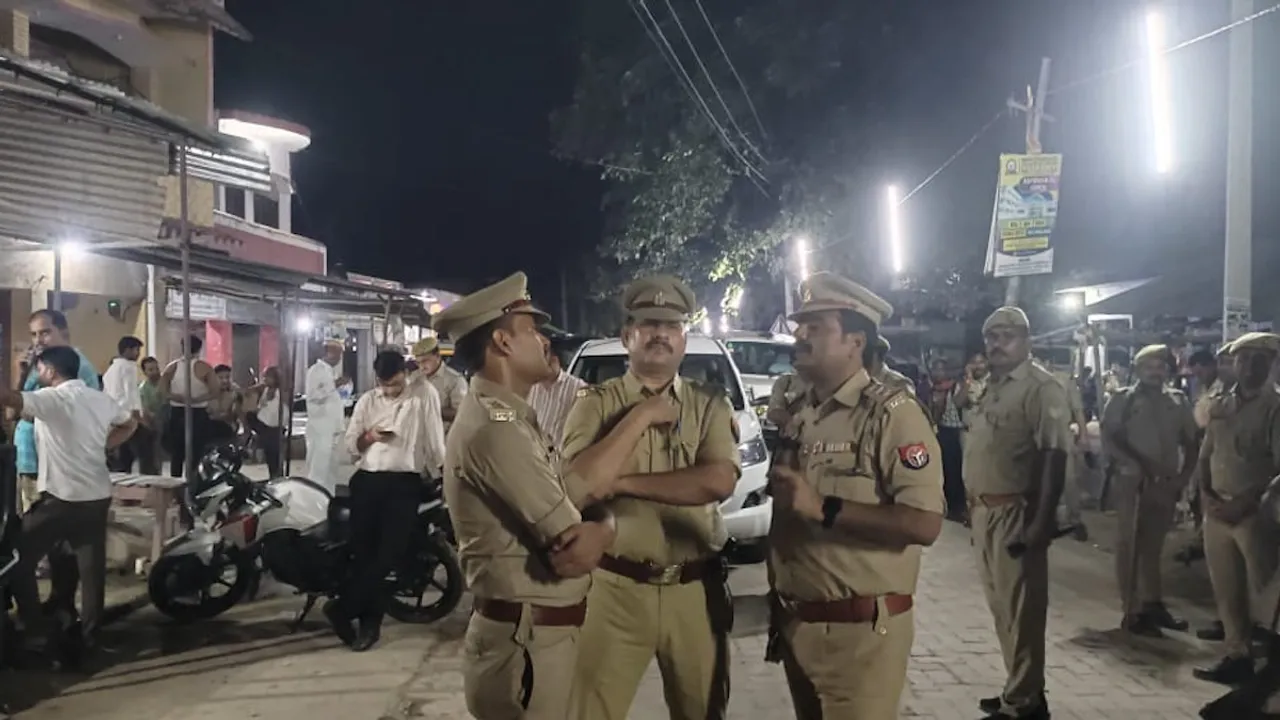 Police personnel investigate after four members of a family were shot dead at their home, in Amethi, Uttar Pradesh, Thursday, Oct. 3, 2024.