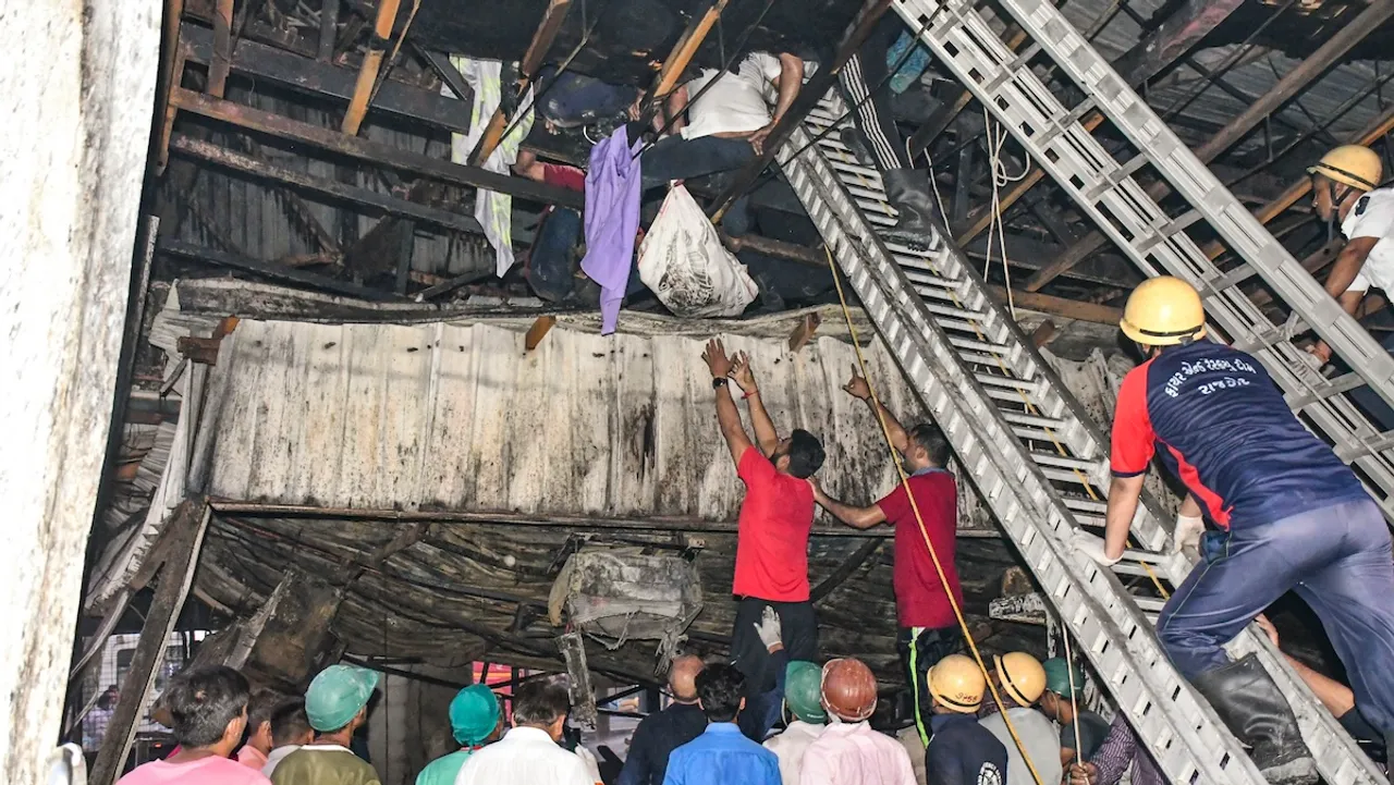 Rescue and relief work underway after a fire broke out in a gaming zone, in Rajkot, Saturday, May 25, 2024. At least 16 persons were killed and several others injured in the massive fire.