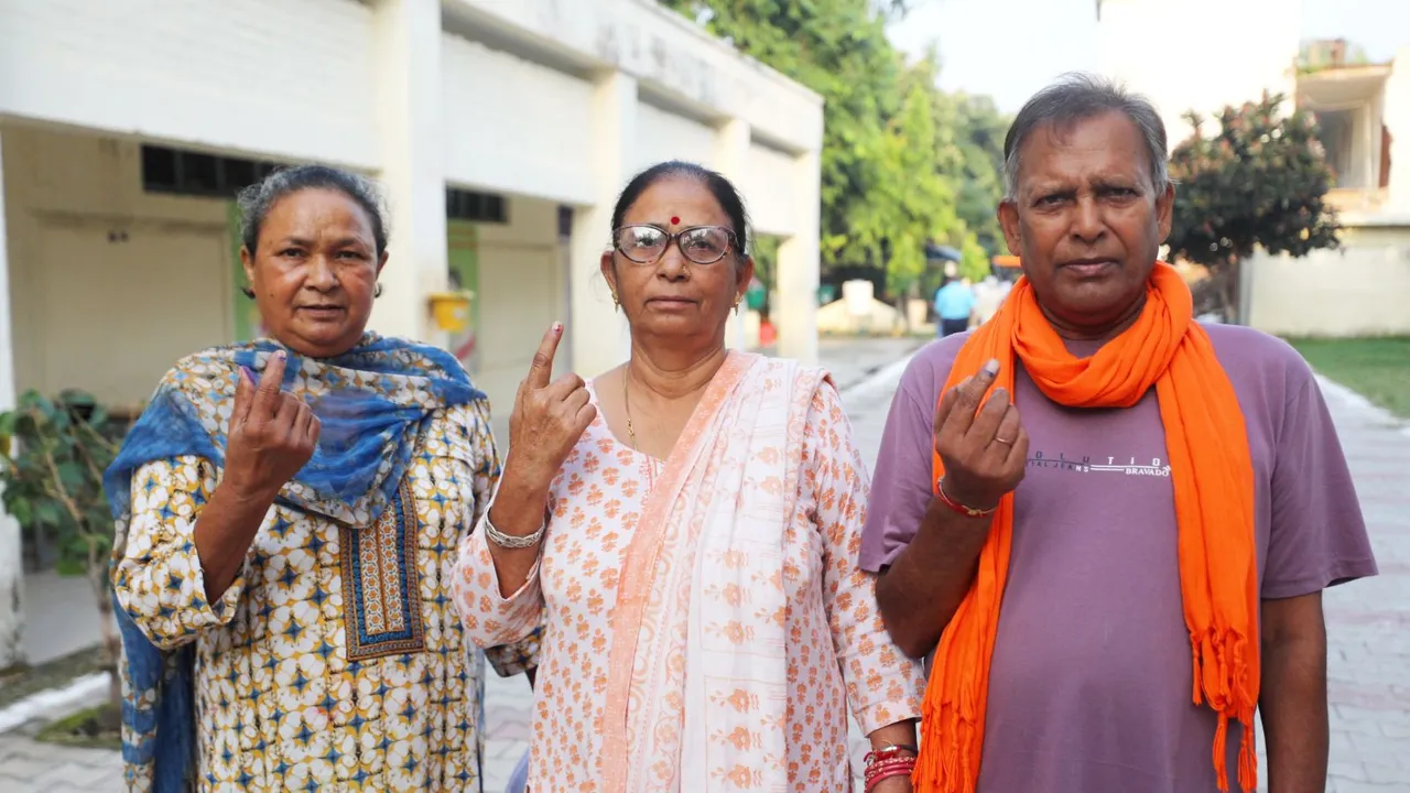 People from the Valmiki community show their fingers marked with indelible ink after casting their votes during the third and final phase of Jammu & Kashmir Assembly elections, at Gandhi Nagar in Jammu, J&K, Tuesday, Oct. 1, 2024.
