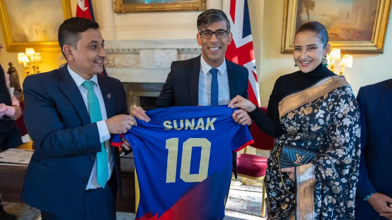 United Kingdom Prime Minister Rishi Sunak holding T20 World Cup Jersey of Nepal along with Manisha Koirala & Prashant Kunwar