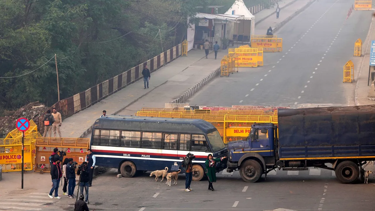 Police barricades put up at Ghazipur border in view of farmers' 'Delhi Chalo March', in New Delhi