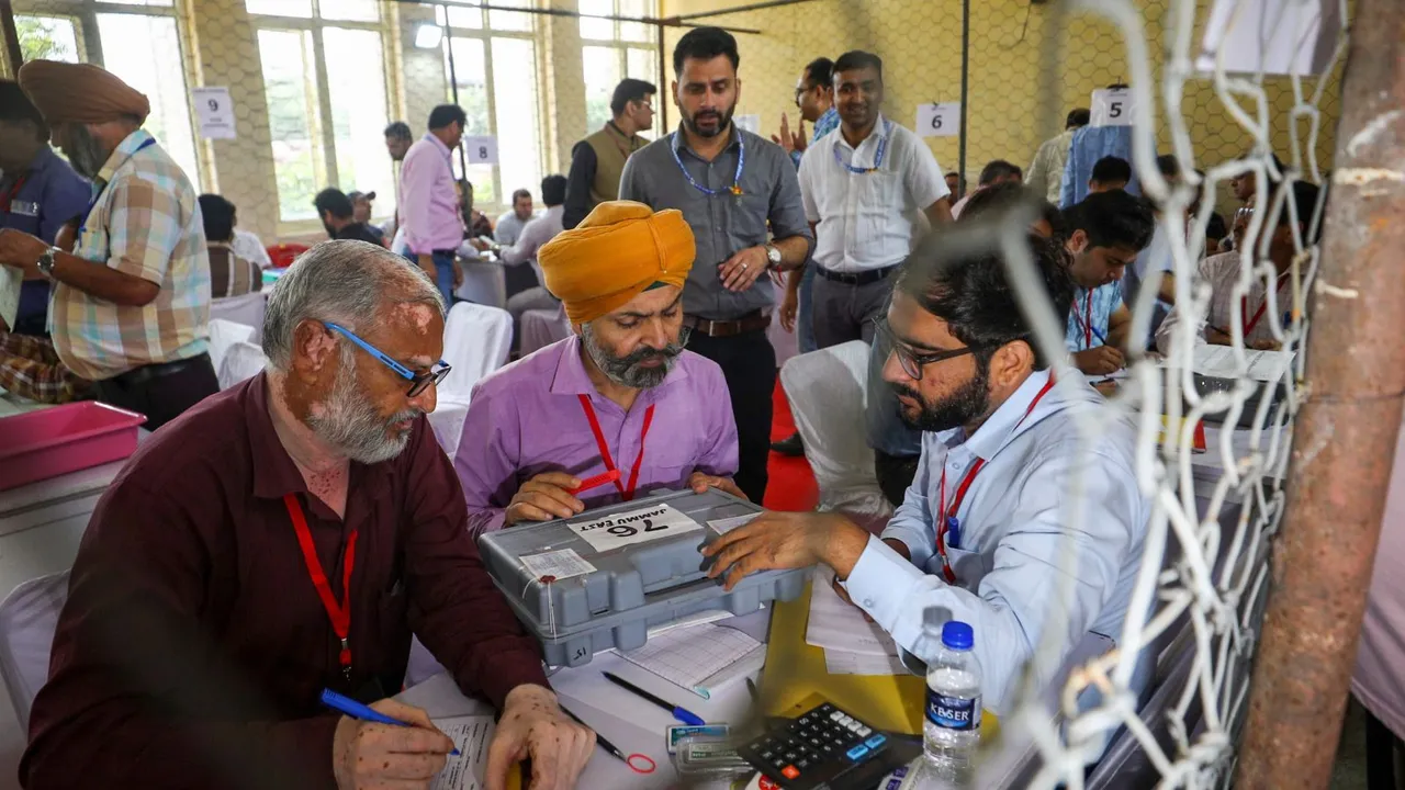 Poll staff at a vote counting centre for J&K Assembly polls, in Jammu, Tuesday, Oct. 8, 2024. 