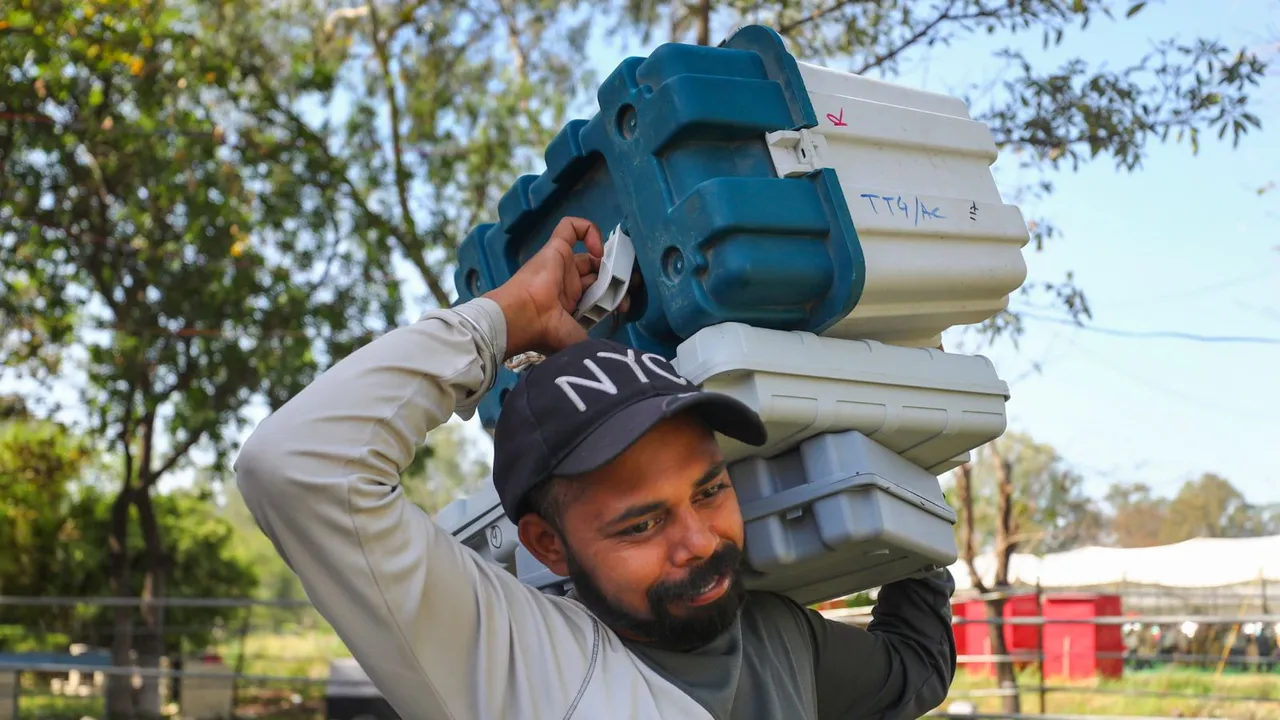 Polling official with EVMs leave for election duty ahead of Lok Sabha elections, in Kathua, Wednesday, April 17, 2024
