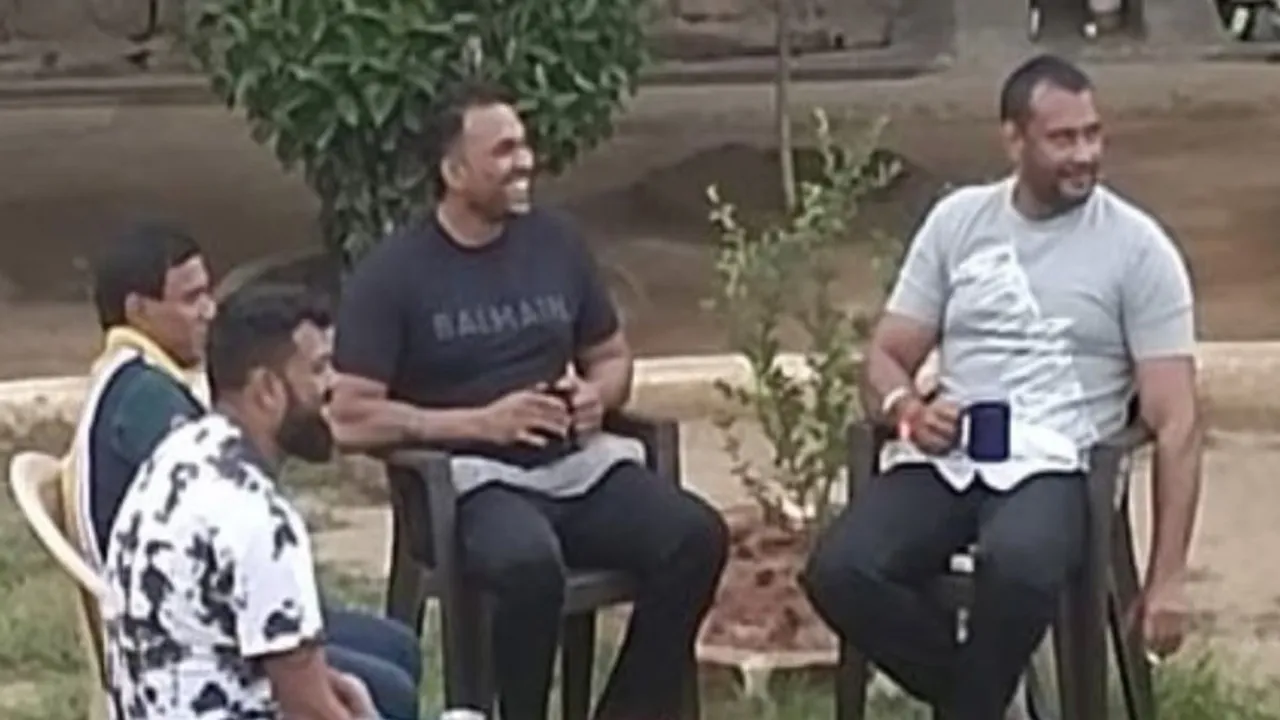 A photo of Kannada actor Darshan Thoogudeepa smoking with a coffee mug