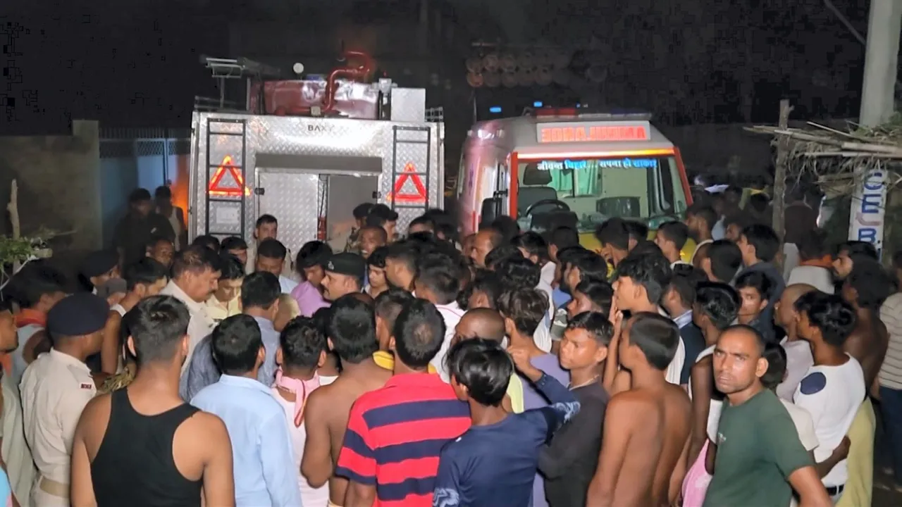 People gathered near an ambulance after Kanwar Yatra pilgrims were electrocuted to death in Sultanpur village, Bihar on Monday, August 5, 2024.