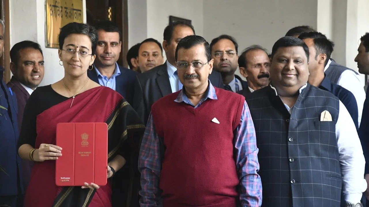 Delhi Finance Minister Atishi Singh with Chief Minister Arvind Kejriwal arrives at the Vidhan Sabha