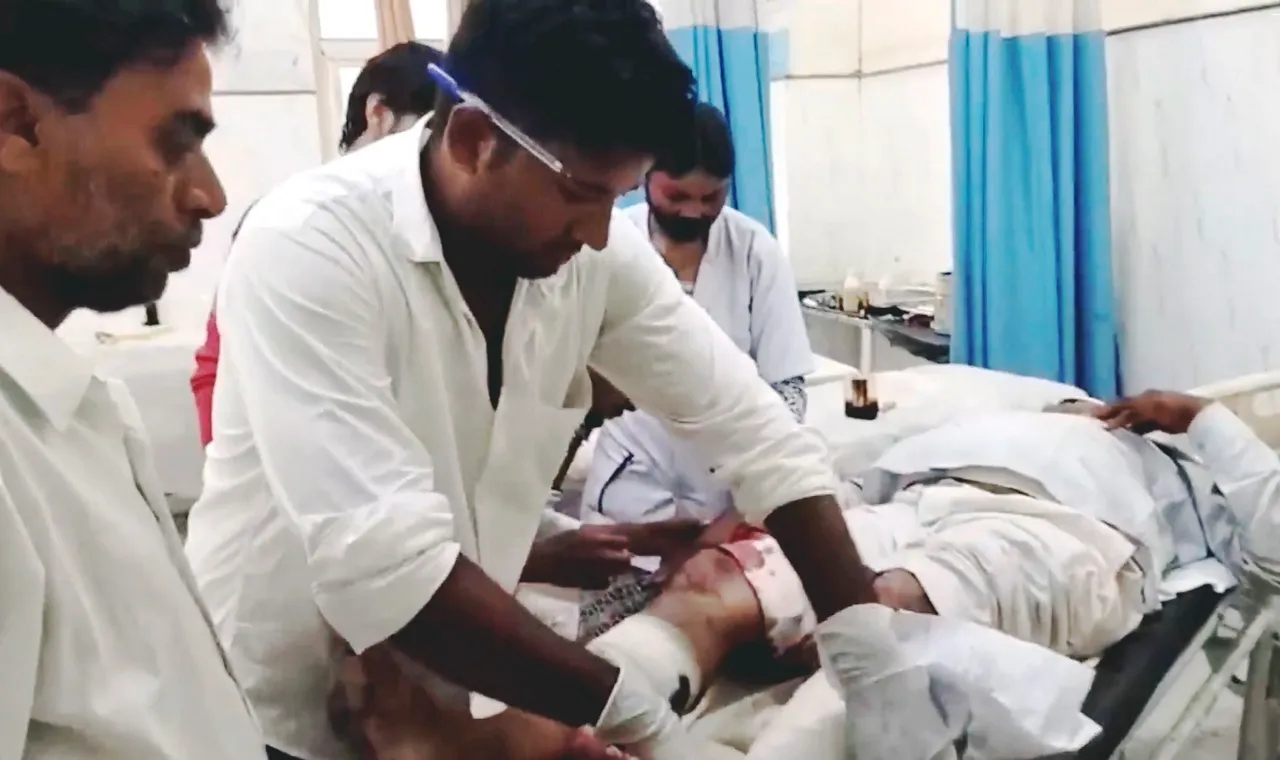Medics attend an injured passenger at a hospital after a trailer rammed into a passenger bus from behind on the Jaipur-Agra National Highway, in Bharatpur district