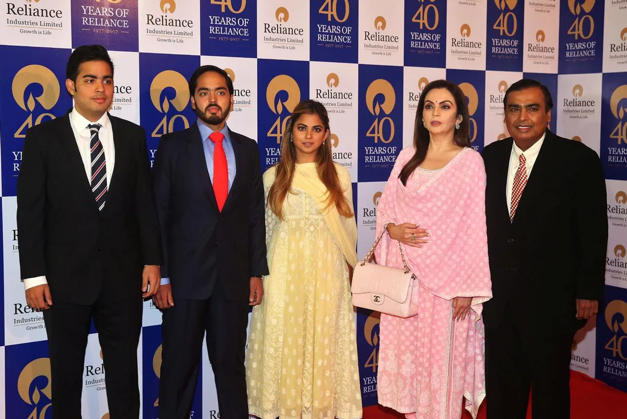 Mukesh Ambani, right, with (from 2nd right to left) wife Nita Ambani, children Isha Ambani, Anant Ambani, and Akash Ambani.