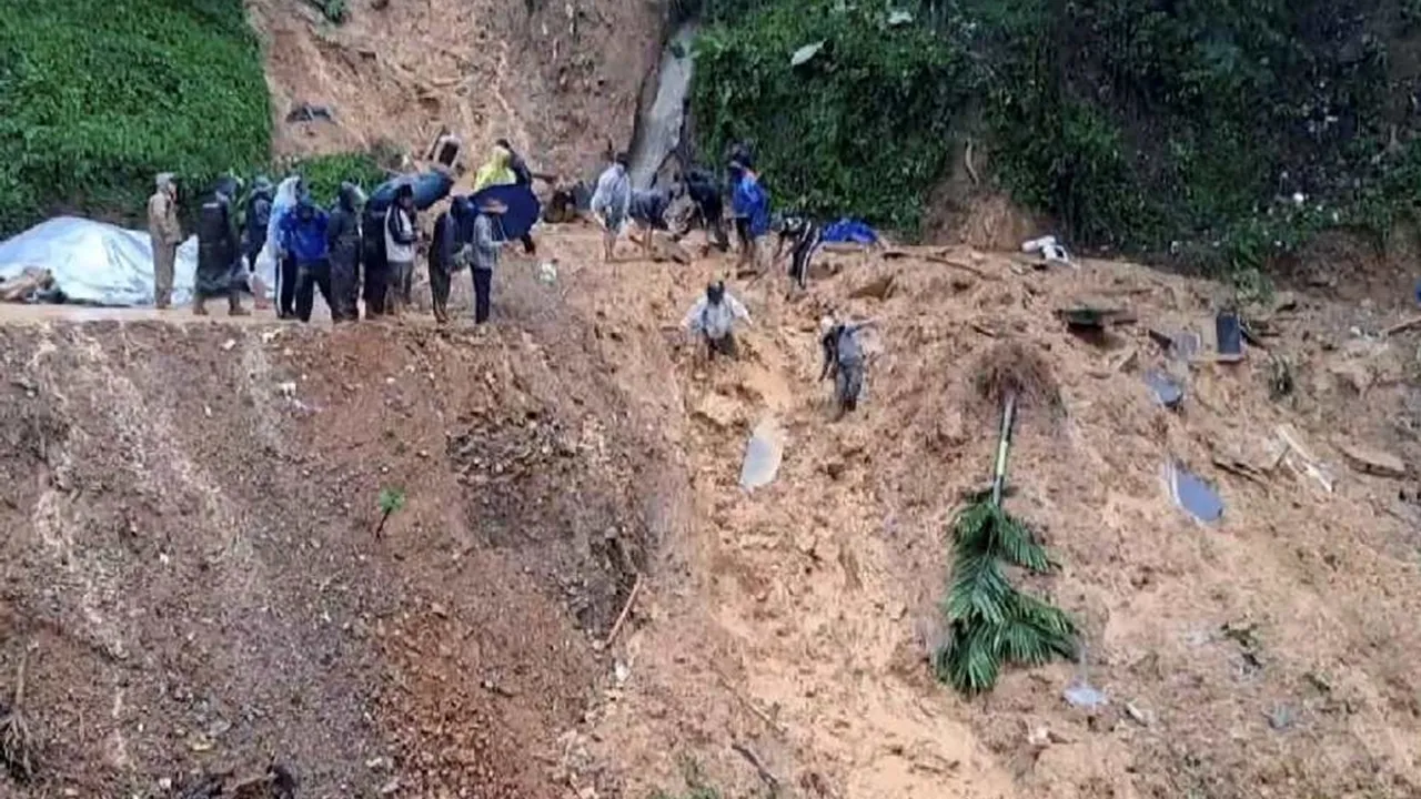 Debris being cleared after landslides due to incessant rains in the aftermath of Cyclone Remal