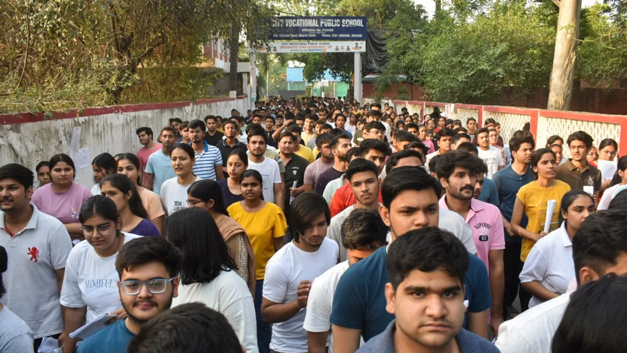 Candidates undergo security check as they arrive to appear for the NEET (UG) 2024 exam at an examination centre