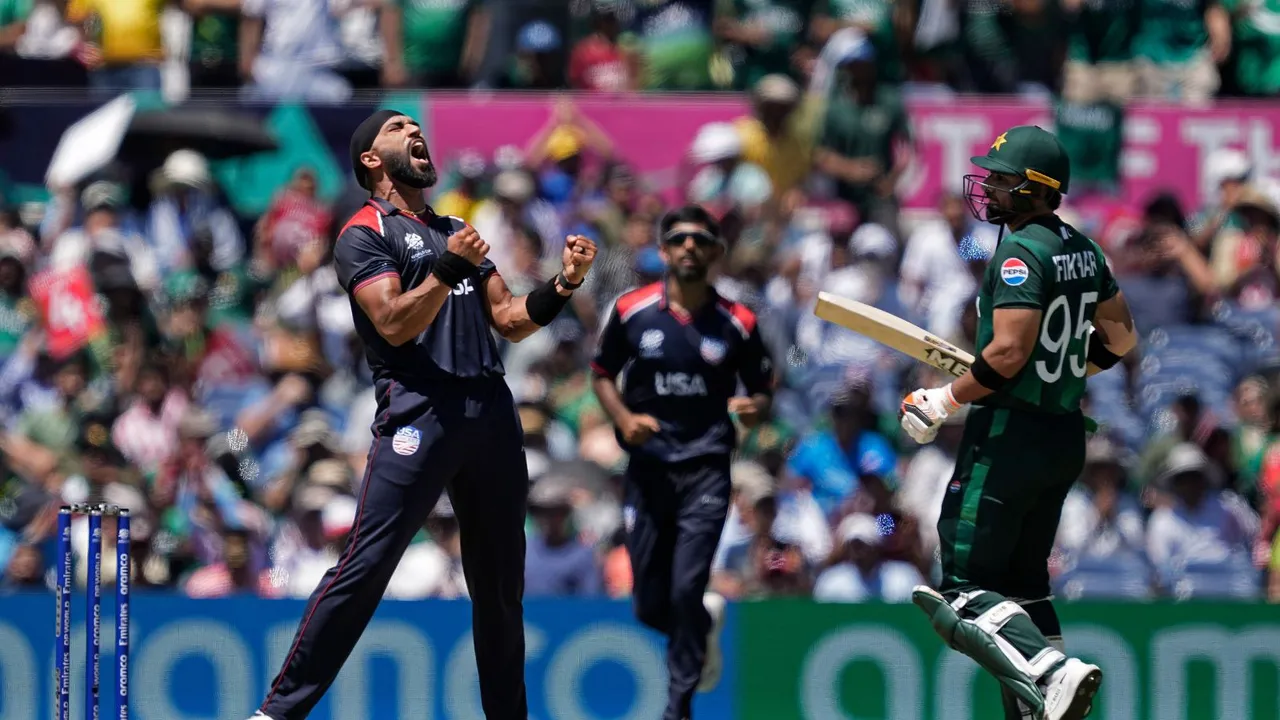 United States' Jessy Singh, left, celebrates the dismissal of Pakistan's captain Babar Azam during the ICC Men's T20 World Cup cricket match between United States and Pakistan