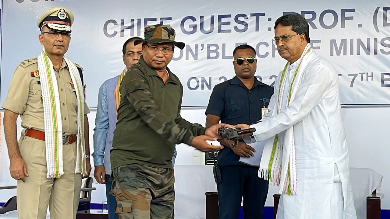 Tripura Chief Minister Manik Saha receives arms from an extremist during a surrender ceremony in Jampuijala, West Tripura, Tuesday, Sept. 24, 2024.