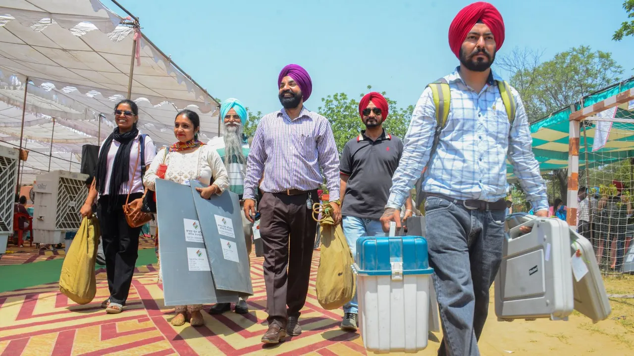 Polling officials check the election material at a distribution center before leaving for their respective polling stations, on the eve of the seventh phase of Lok Sabha elections, in Amritsar, Friday, May 31, 2024