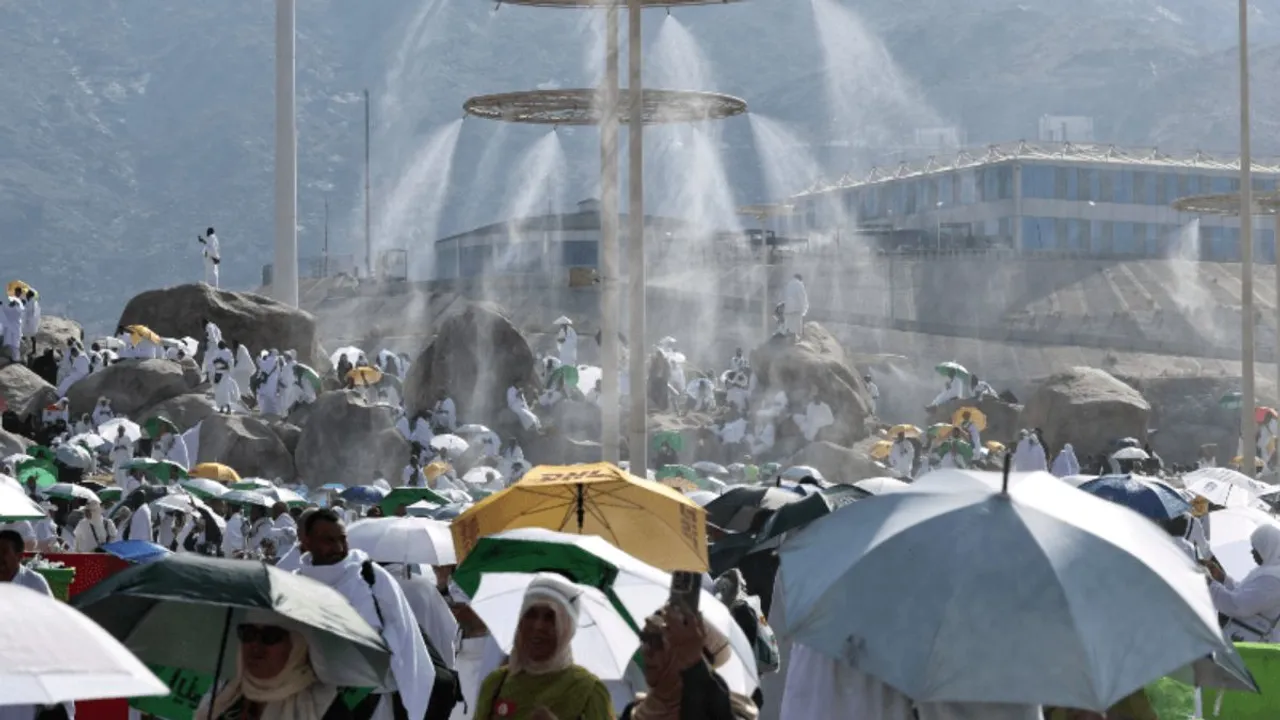 Mist dispensers refreshen Muslim pilgrims at the base of Saudi Arabia’s Mount Arafat, also known as Jabal al-Rahma or Mount of Mercy, during the climax of the Hajj pilgrimage on June 15, 2024