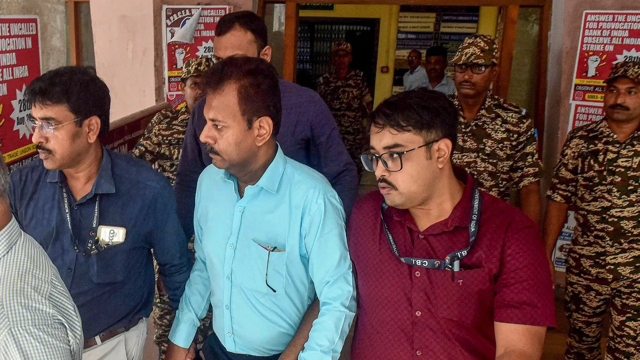 CBI officials take Ex-RG Kar College principal Sandip Ghosh, in blue shirt, to the court, in Kolkata, Tuesday. Sept. 10 ,2024.