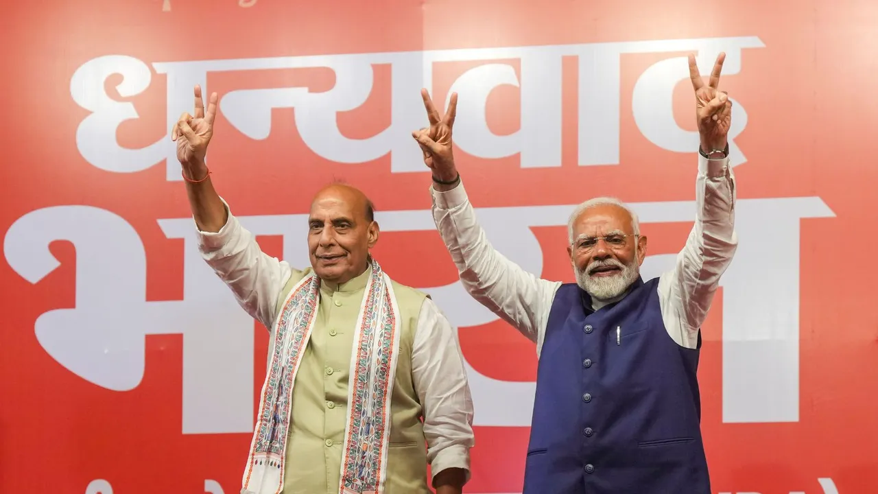 Prime Minister Narendra Modi and Defence Minister Rajnath Singh at the party headquarters as the party leads in the Lok Sabha elections amid the counting of votes, in New Delhi, Tuesday, June 4, 2024