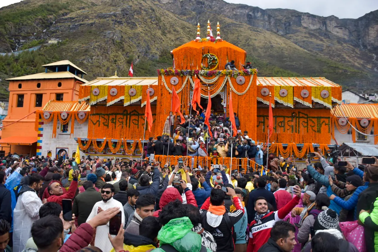 Devotees arrive at the Shri Badrinath temple after its portals were opened, in Chamoli district, Sunday morning, May 12, 2024