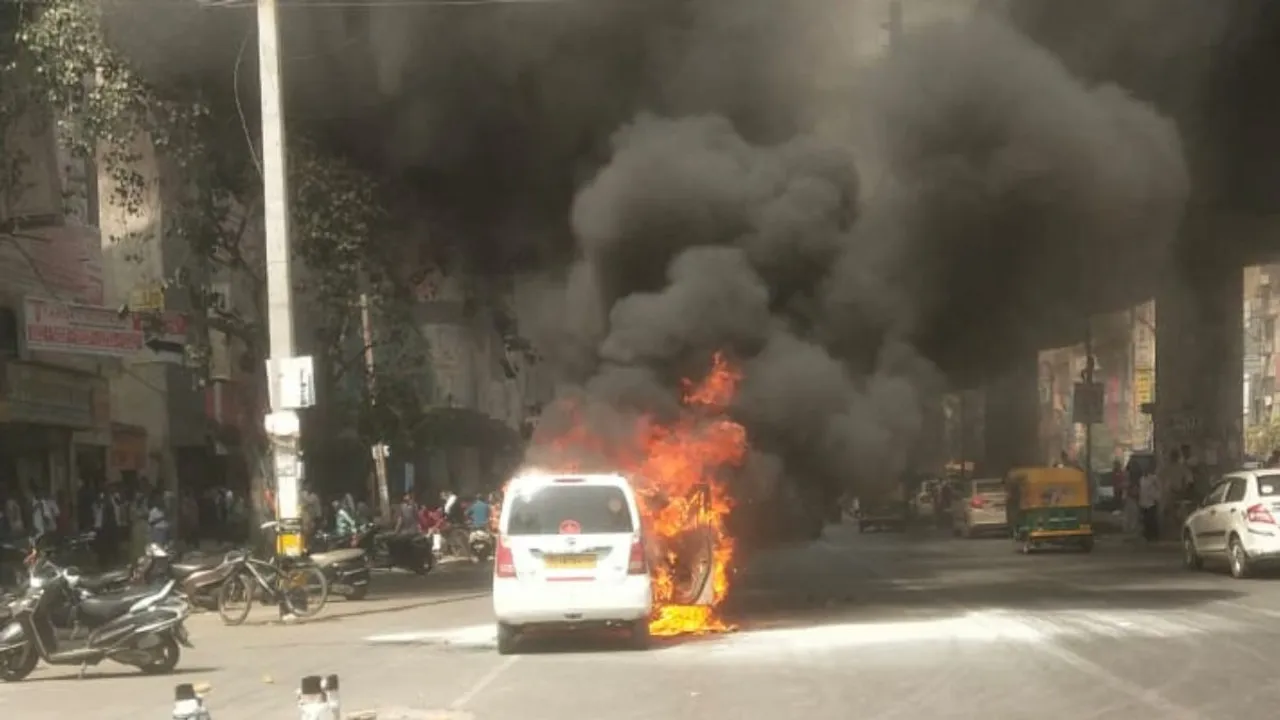 A taxi car was reduced to ashes after the moving vehicle caught fire in the Uttam Nagar area in west Delhi on Monday