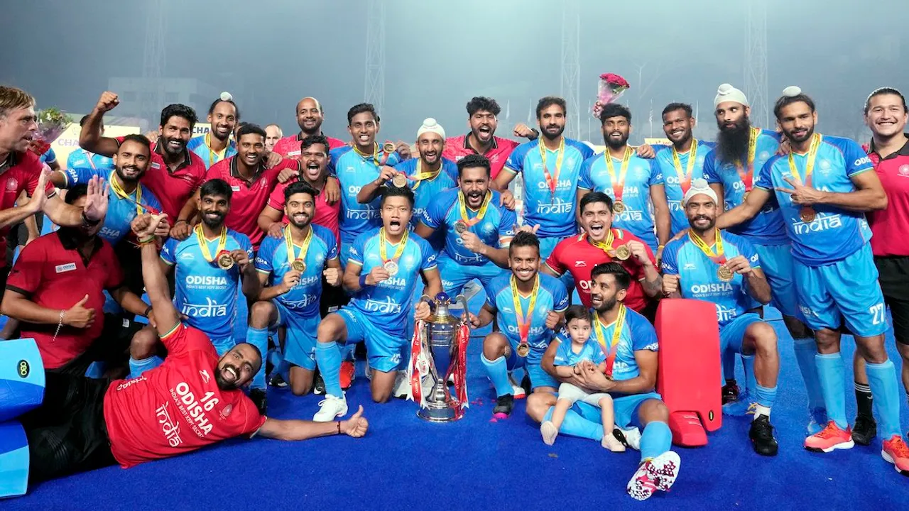 Indian players and support staff pose with the trophy after winning the Asian Champions Trophy 2023, in Chennai, Saturday, Aug. 12, 2023. India beat Malaysia 4-3 in the final to claim their fourth Asian Champions Trophy title.