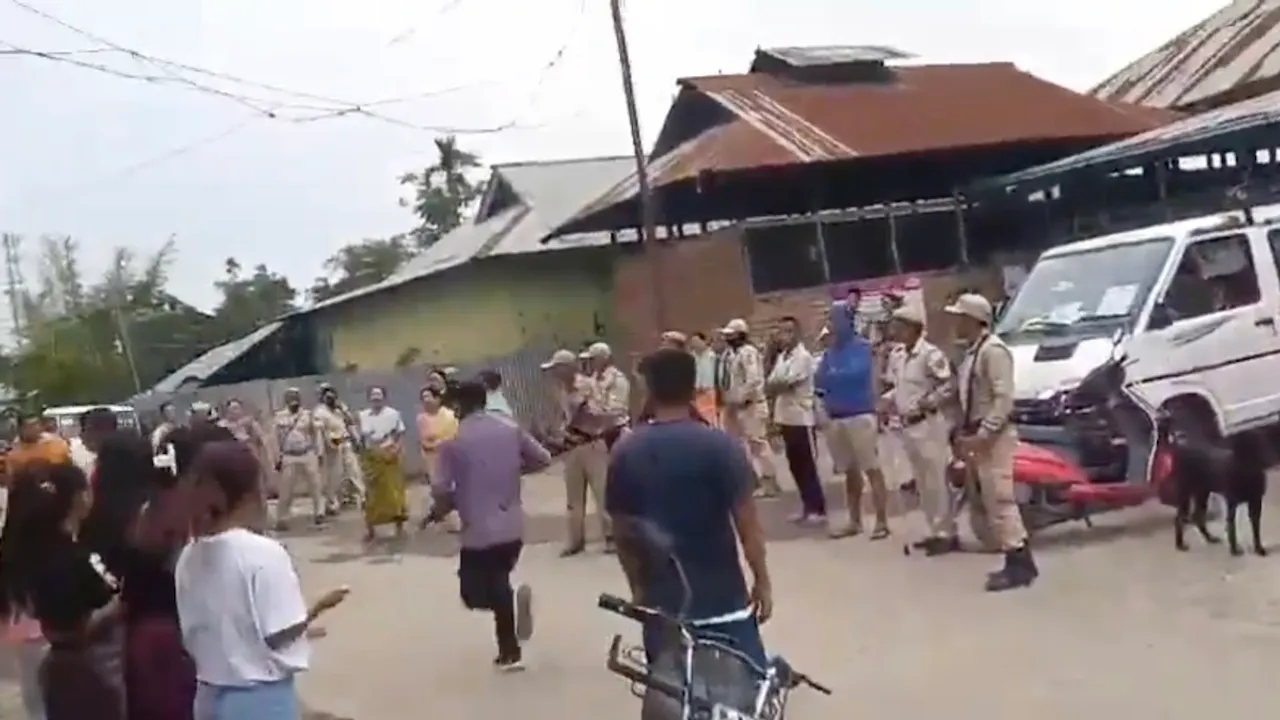 A videograb in which armed men can be seen attempting to capture polling booth in Manipur
