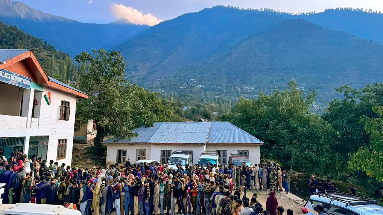 Voters wait in long queues at a polling station during the 2nd phase of Assembly polls, in Ganderbal, J & K, Wednesday, Sept. 25, 2024.