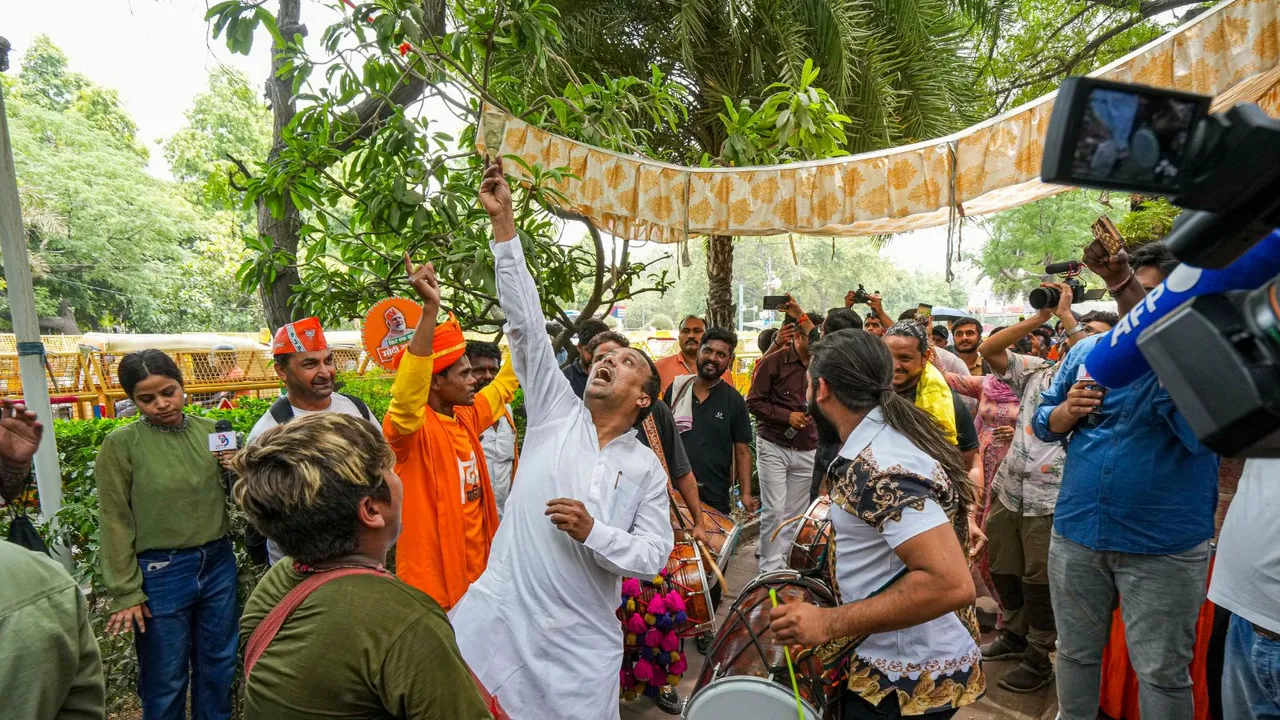 BJP supporters celebrate the party's lead during counting of votes for Lok Sabha elections, at BJP headquarters in New Delhi, Tuesday, June 4, 2024