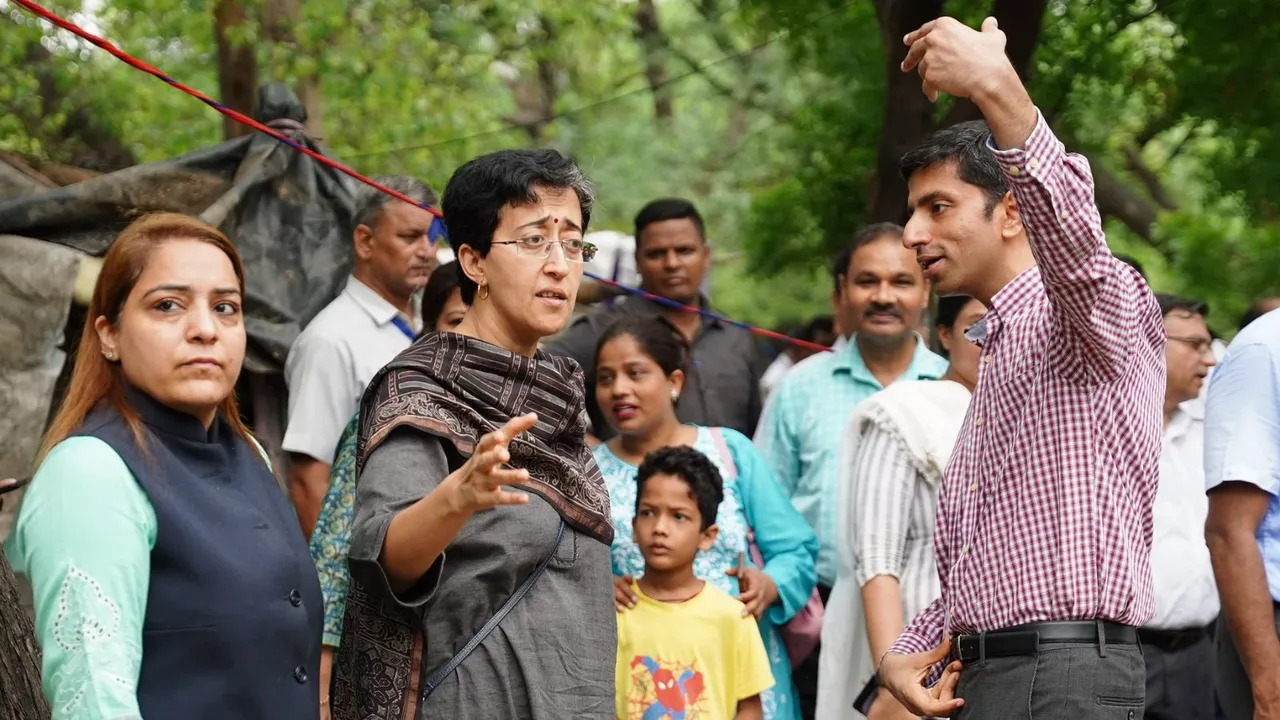 Delhi minister Atishi inspecting the drain along with senior officials