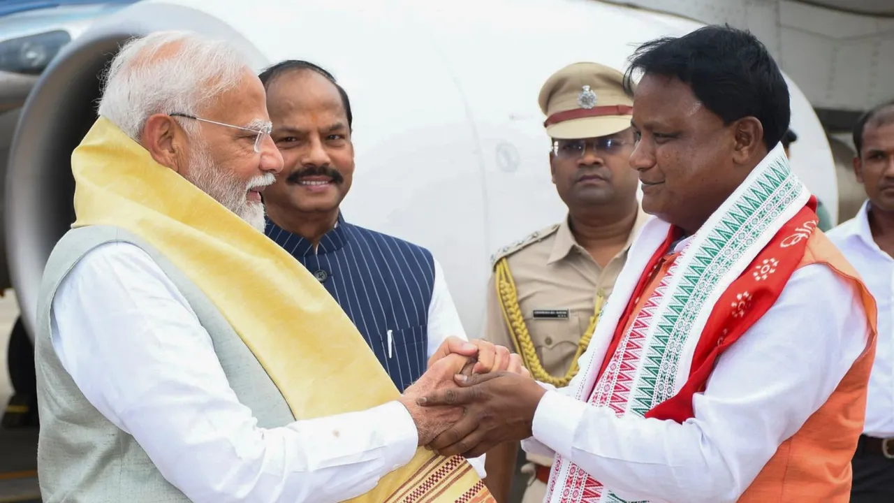 Prime Minister Narendra Modi being greeted by Odisha's Chief Minister-designate Mohan Charan Majhi before the latter's swearing-in ceremony, in Bhubaneswar.