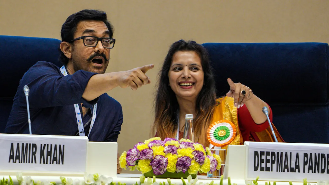 Actor Aamir Khan with with a school Principal Deepmala Pandey during an interaction session at the National Conclave on 'Mann Ki Baat @100' on April 26