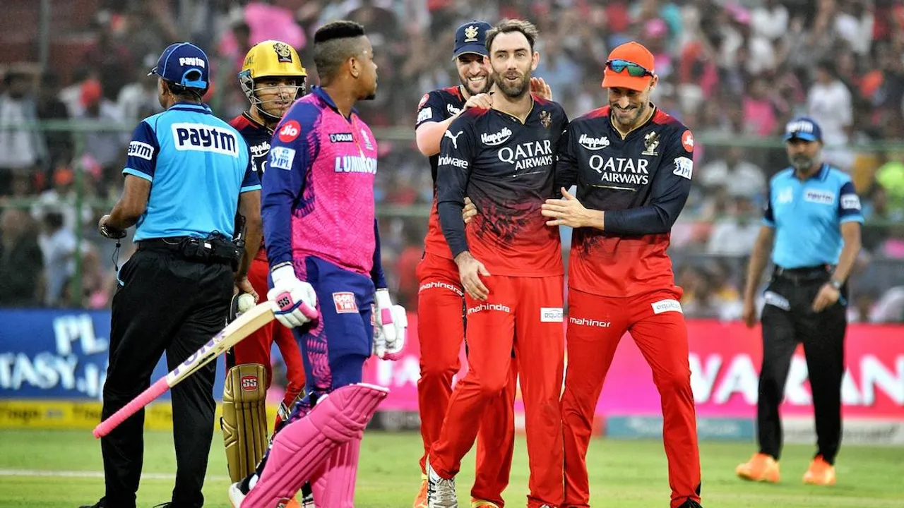 Royal Challengers Bangalore players celebrate the wicket of Rajasthan Royals batter Shimron Hetmyer at Sawai Mansingh Stadium on May 14