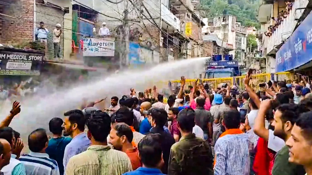 Water cannons being used on agitators during a protest over alleged illegal construction at a mosque in Shimla, in Mandi, Friday, Sept. 13, 2024.