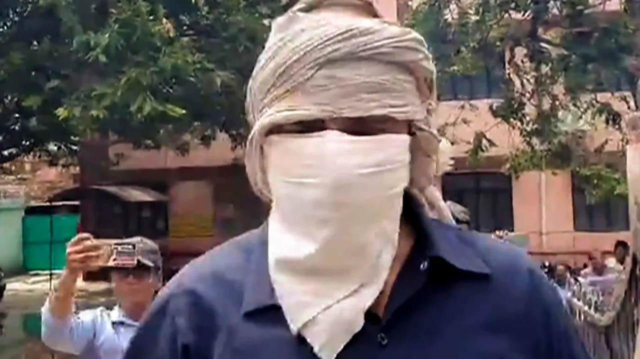 Prime accused of the Hathras stampede case, Devprakash Madhukar, being brought by police to a hospital for medical examination, in Hathras, Saturday, July 6, 2024.