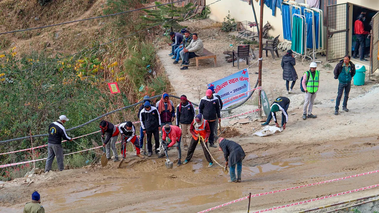 Border Roads Organisation (BRO) officials prepares a road outside the Silkyara Bend-Barkot Tunnel during the ongoing rescue operation