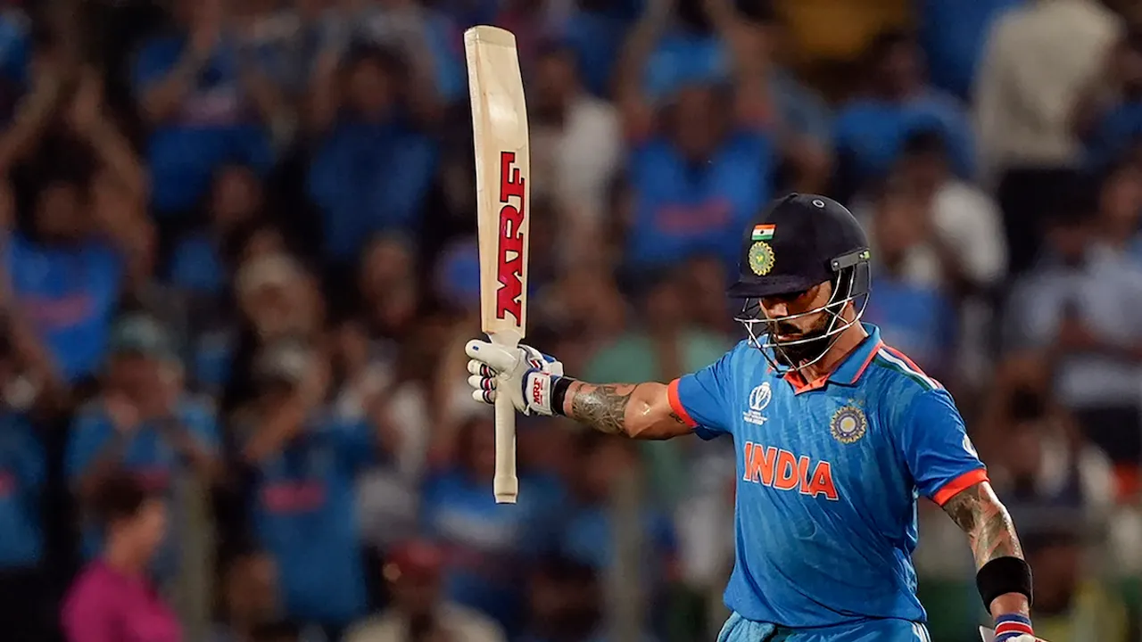 Virat Kohli celebrates his half century during the ICC Men's Cricket World Cup 2023 match between India and Bangladesh, at Maharashtra Cricket Association Stadium, in Pune, Thursday, Oct. 19, 2023.