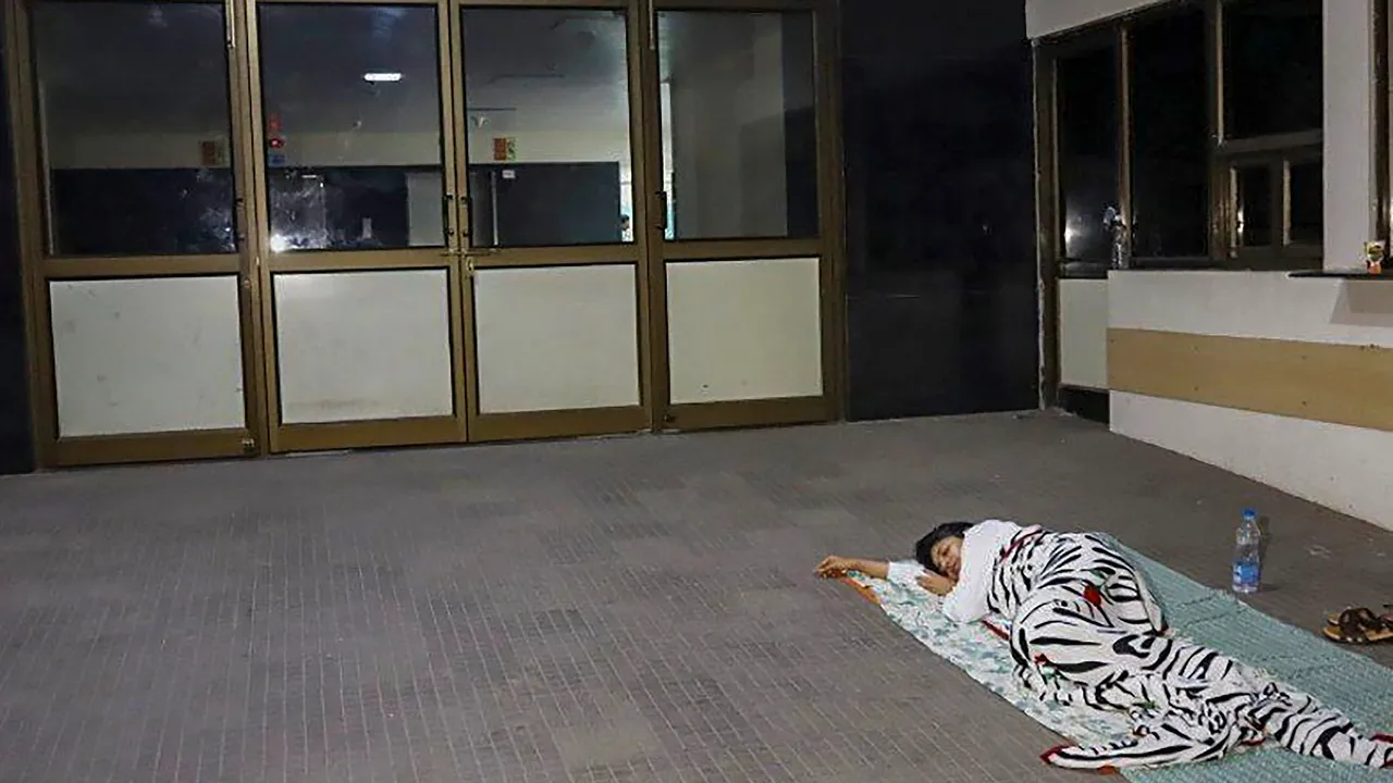 Delhi Commission for Women (DCW) Chairperson Swati Maliwal sleeps outside the hospital where a minor who was allegedly raped by a Delhi government officer is admitted, in New Delhi