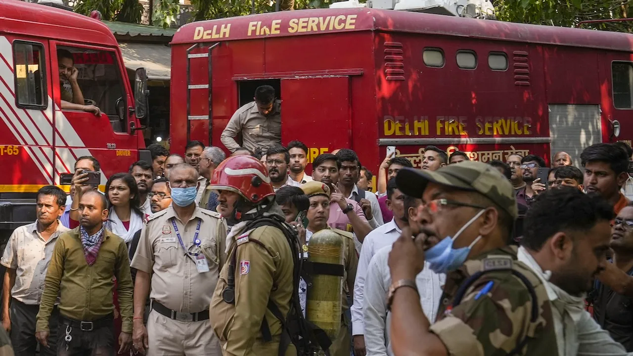 Firefighting team outside the Income Tax CR Building after a fire broke out here, in ITO area of New Delhi, Tuesday, May 14, 2024.