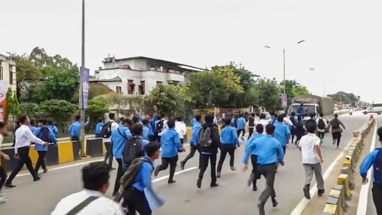 Members of All Manipur Students' Union (AMSU) charge towards a CRPF convoy during a protest march against the recent violence in the state, in Imphal, Monday, Sept 9, 2024.
