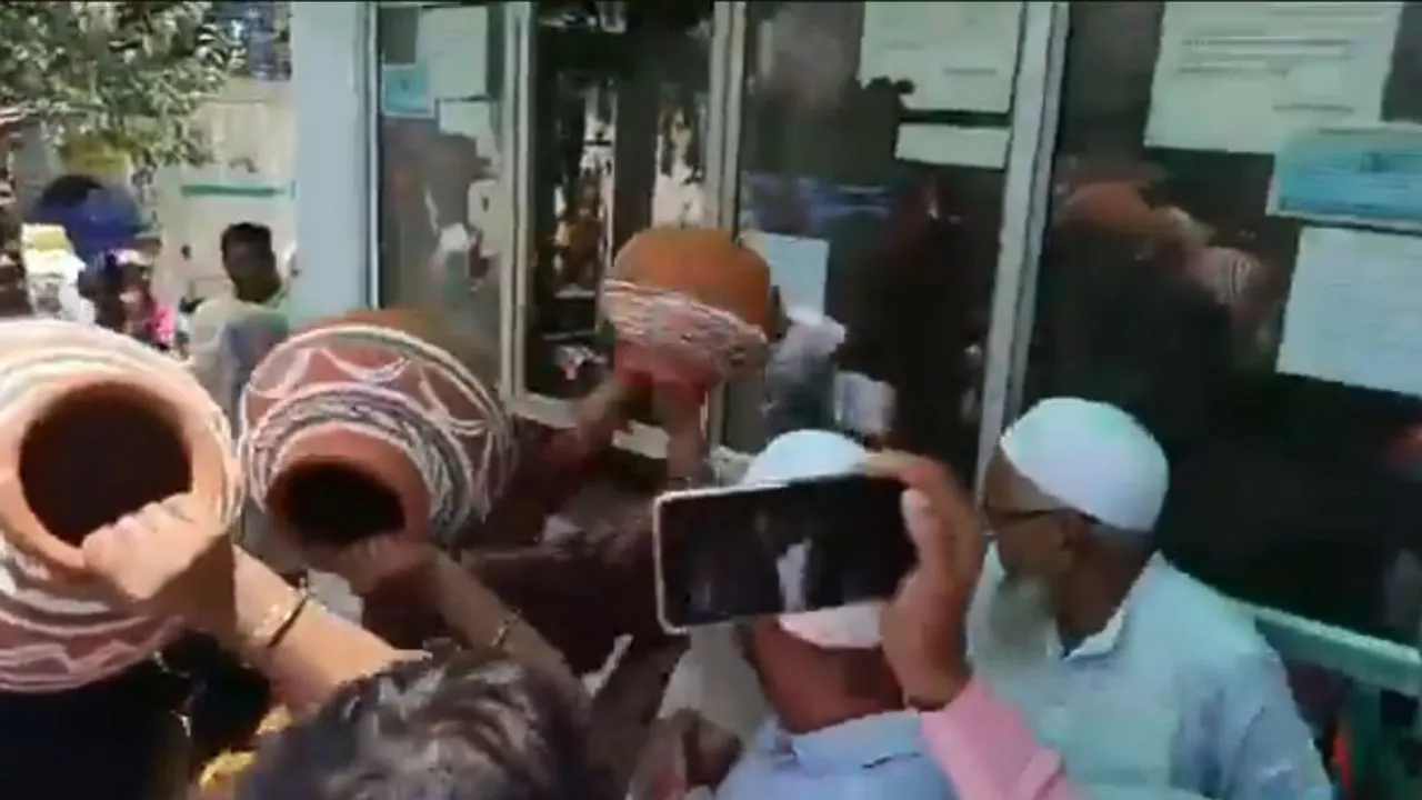 BJP leaders and workers vandalising an office of the Delhi Jal Board