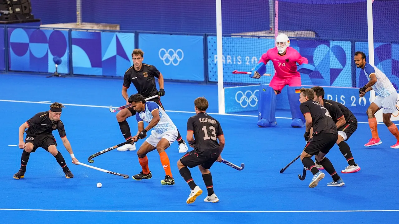 Indian and German players vie for the ball during their men's hockey semi-final match at the 2024 Summer Olympics, in Colombes, France, Tuesday, Aug. 6, 2024.