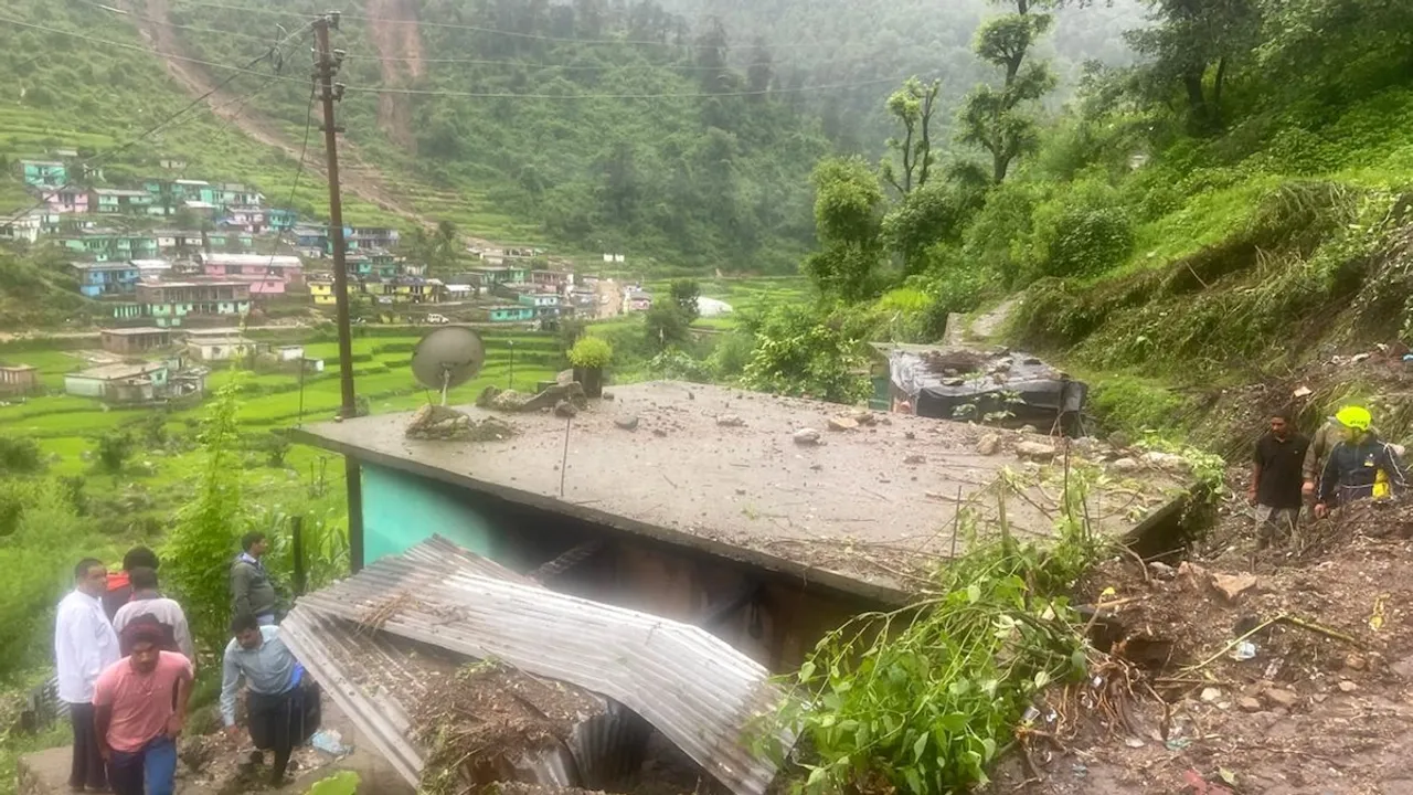 Rescue work underway after a woman and her daughter got buried under the debris of a house following a landslide, in Tehri Garhwal district, Saturday, July 27, 2024