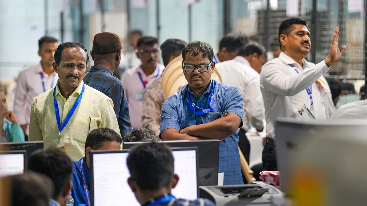 Polling officials at a counting centre on the day of counting of votes for Lok Sabha elections, in Mumbai, Tuesday, June 4, 2024