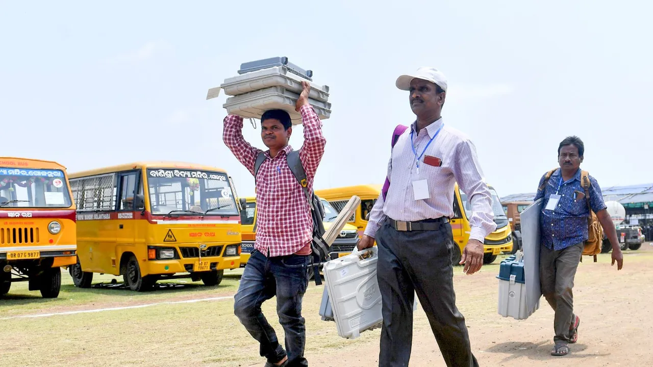 Polling officials carrying the Electronic Voting Machines (EVMs) and other election material leave for their respective polling booths, a day before voting in the fourth phase of Lok Sabha elections, in Berhampur, Sunday, May 12, 2024