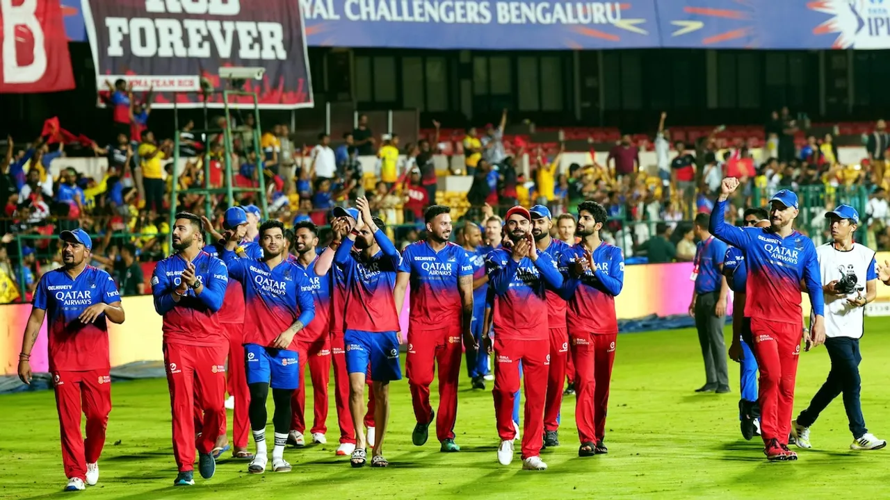 Royal Challengers Bengaluru players acknowledge fans as they celebrate after winning their Indian Premier League (IPL) 2024 cricket match against Chennai Super Kings, at M Chinnaswamy Stadium in Bengaluru, Saturday, May 18, 2024.
