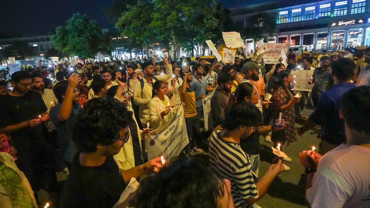 Members of various Resident Doctors Associations protest during a candle march against the alleged rape and murder of a woman doctor at Kolkata's RG Kar Medical College and Hospital, at Connaught Place, in New Delhi, Sunday, Aug. 18, 2024.