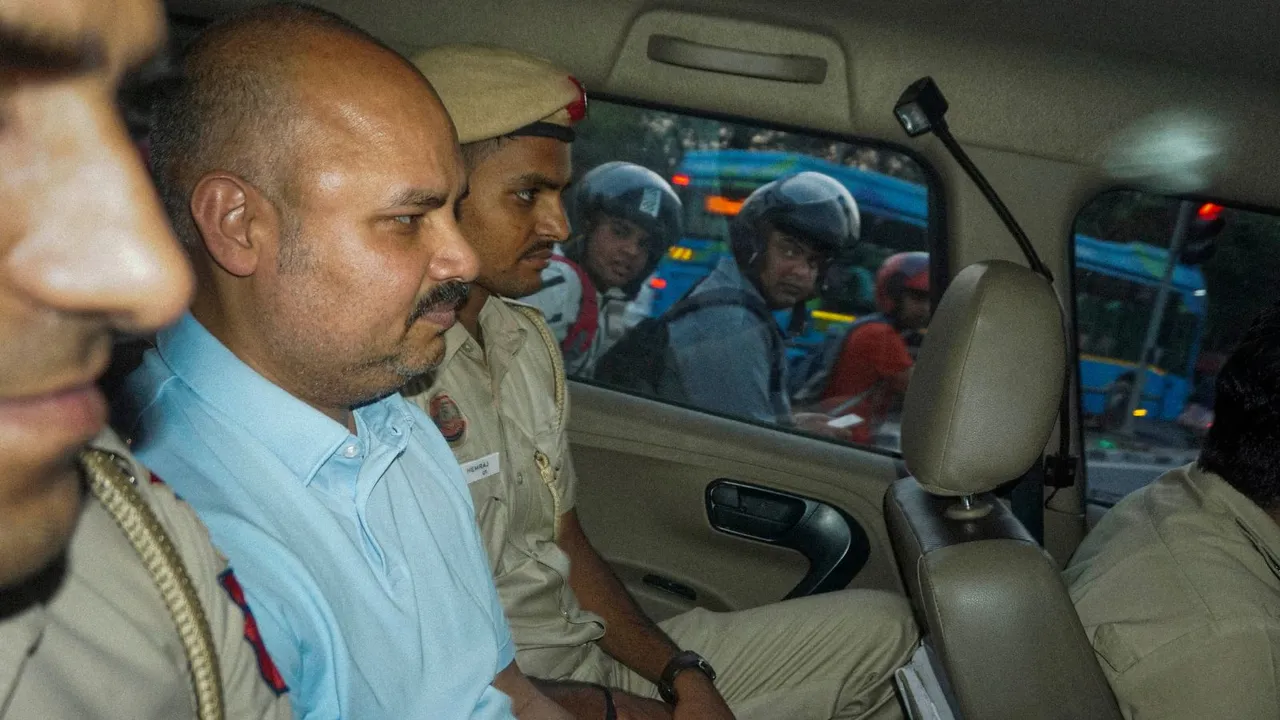 Delhi Police personnel with Chief Minister Arvind Kejriwal's aide Bibhav Kumar leave Kejriwal's residence after recreation of the scene in AAP MP Swati Maliwal's assault case, in New Delhi, Monday, May 20, 2024